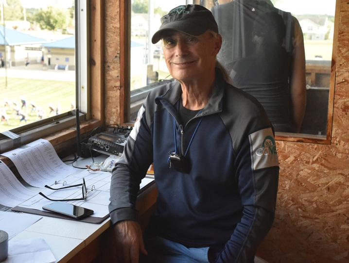 John Koehn sits for a photo from his spot in the press box at Maple Stadium.