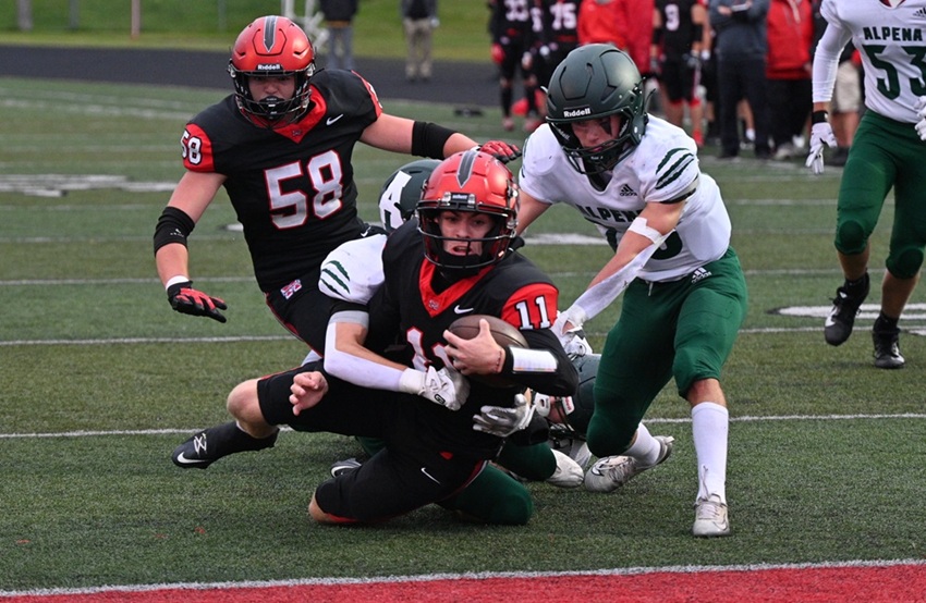 Marquette's quarterback Ford Richardson is able to just get in the end zone to score a touchdown against Alpena.