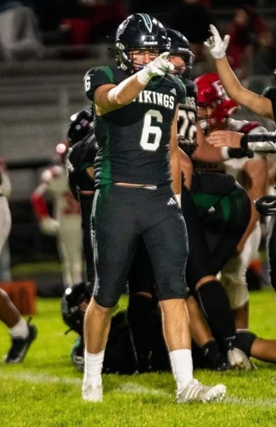 Hunter points to his team’s sideline after the play. 