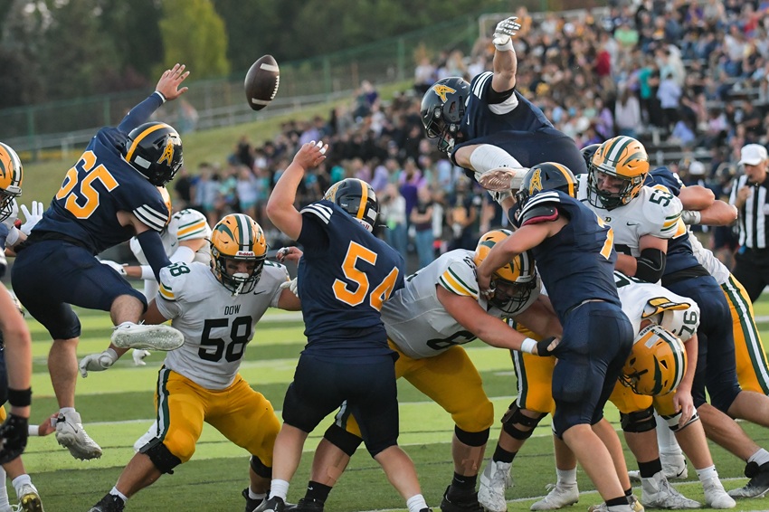 Mount Pleasant attempts to block a Midland Dow kick.