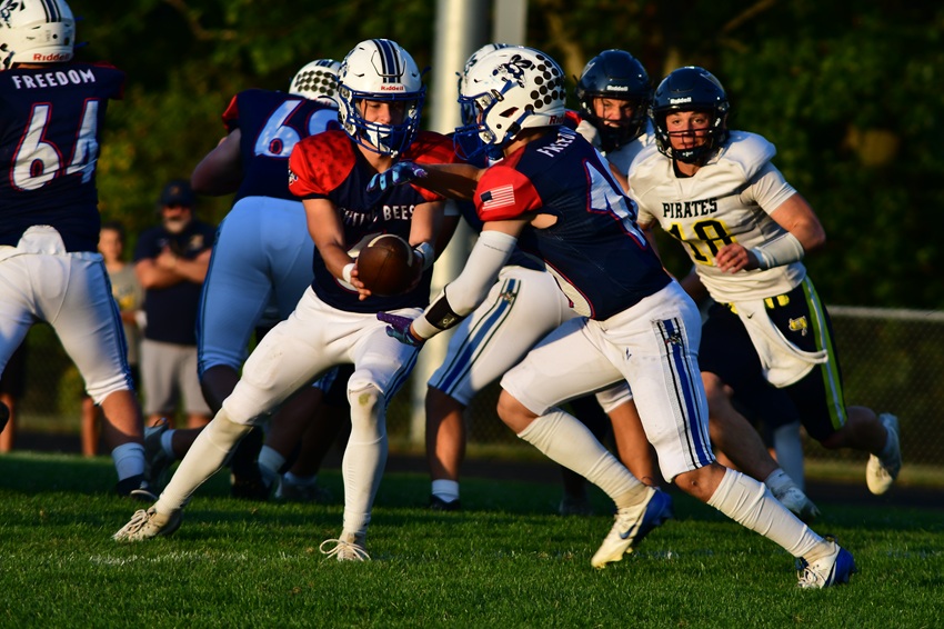 Bath's Rylen Dixon (10) takes a handoff during his team's game against Pewamo-Westphalia.