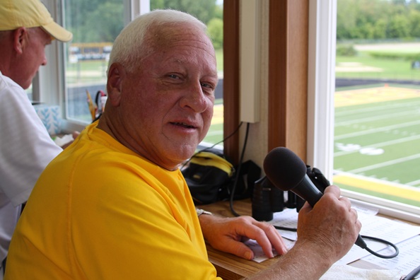 Joostberns takes a moment for a photo  while behind the microphone.