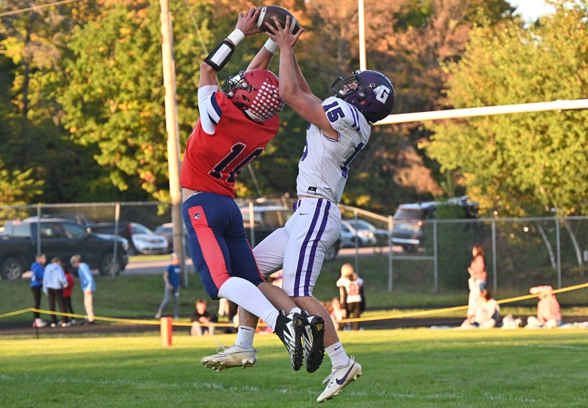 Ishpeming Westwood's Ethan Marta and Gladstone's Trevor Thorbahn jump up for a ball intended for Thorbahn, but Marta is able to hit it away. 