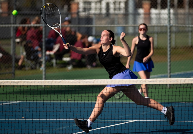 Ishpeming’s Stella Nerlfi gets to a ball at the net at No. 1 doubles.