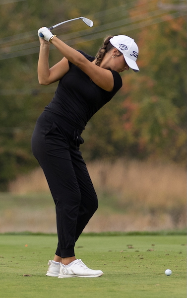 Plymouth's Annie Flavin hits an iron shot.