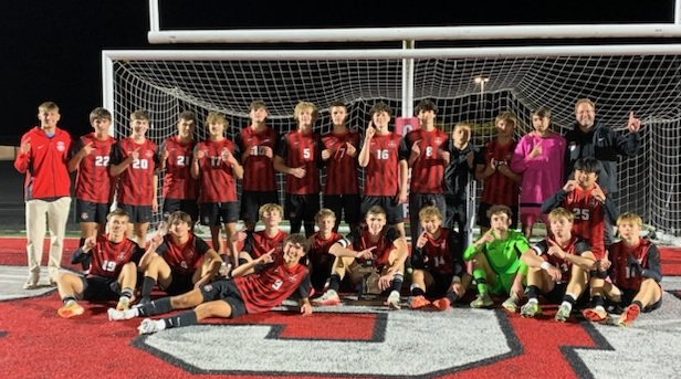 The Red Hawks take a team photo after securing the District title last week.