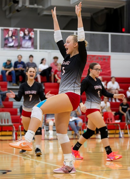 Aubrey Hellebuyck (5) enjoys a moment with her team.