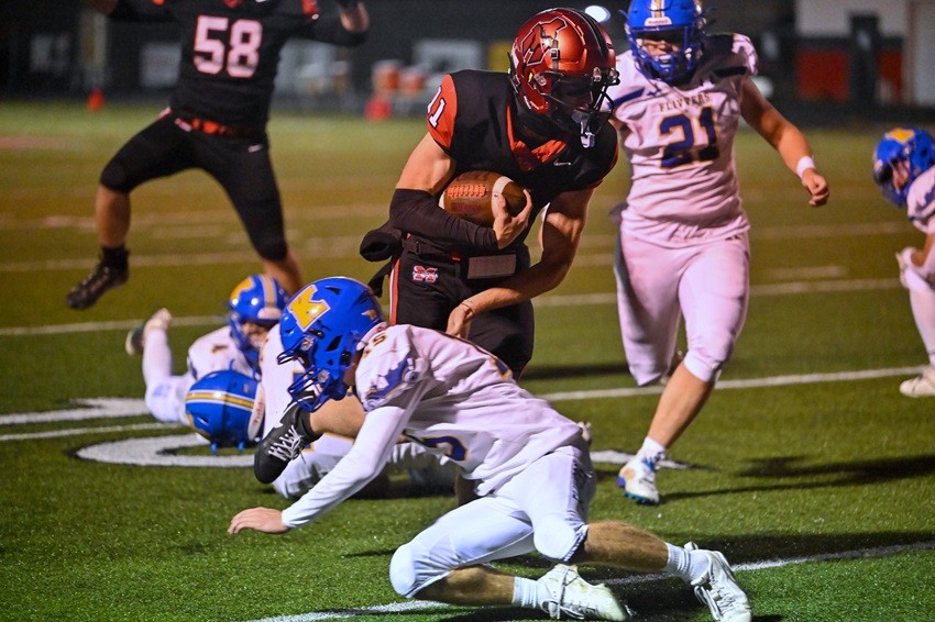 Marquette's Ford Richardson (11) eludes a Kingsford defender.