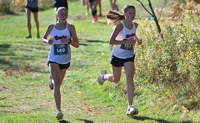 Cooke (149) and Niska (153) run together during the UP Division 1 Cross Country Finals at Pictured Rocks in Munising. 