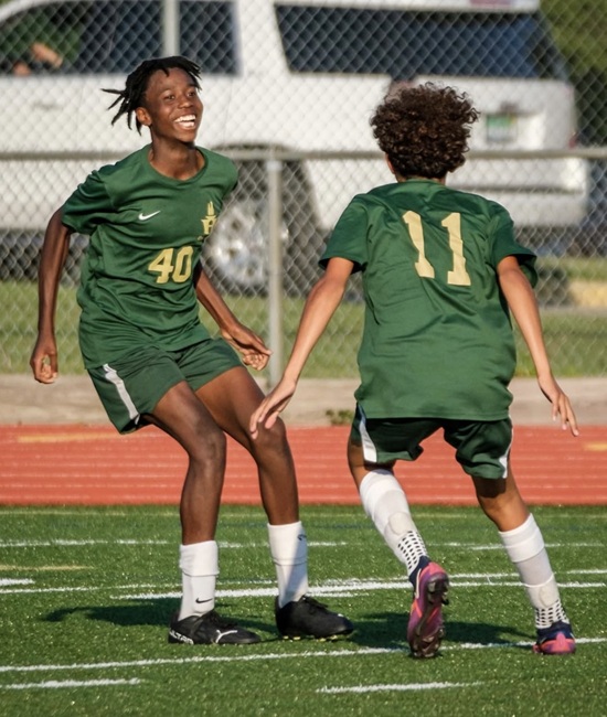 Kinley Poole (left) and Malic Kasham celebrate a moment.
