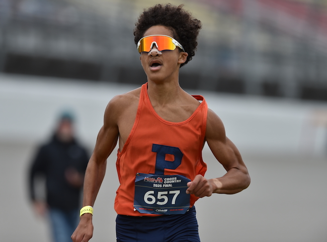 Flint Powers Catholic’s Lennox Naswell surges through the closing stretch at MIS.