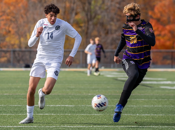 DCD’s Yousef Darwich makes a run with the Rams’ Luke Swearingen defending. 