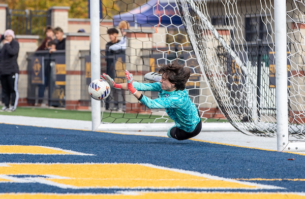 Comets keeper Ravello Smith makes a save during the shootout.