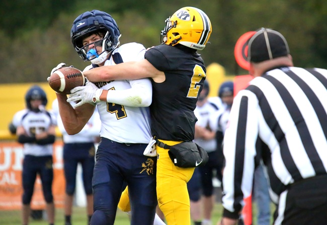 BR-H's Gabe Spear (4) hauls in pass as Brayden Kassin (2) tries to break it up. 