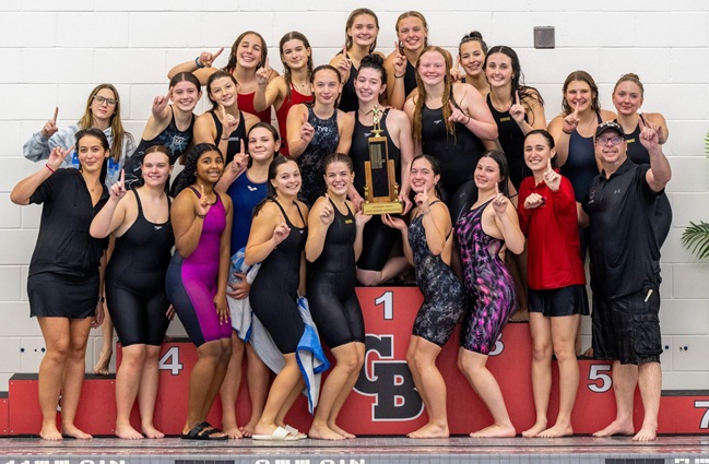 The Bobcats stand for a trophy photo after clinching the Saginaw Valley League championship.