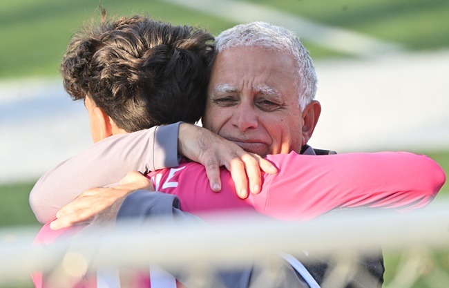  Mukhtar embraces keeper Giovanni Vitale after his team’s 2024 championship win.