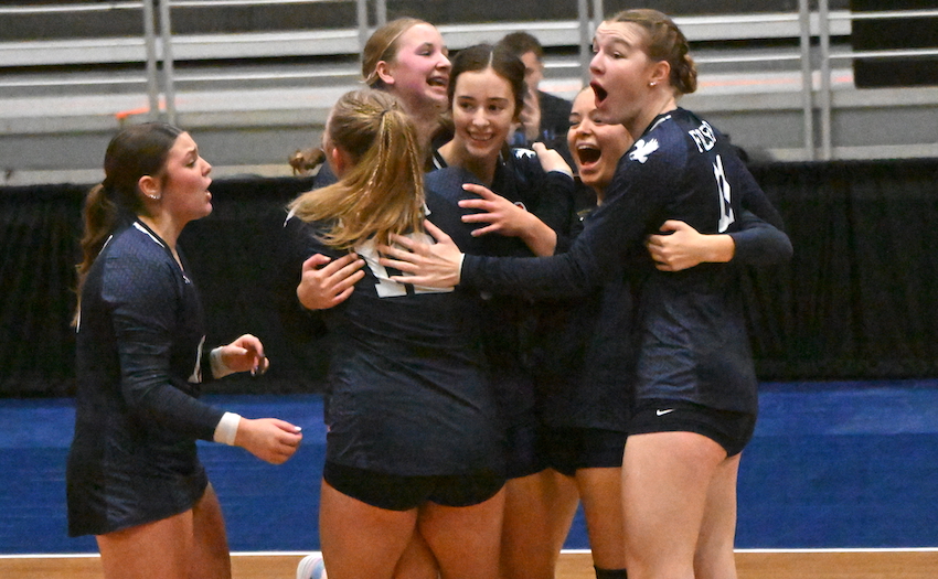 Fowler players celebrate their 26-24, 30-28, 20-25, 19-25, 15-8 win over Crystal Falls Forest Park in the day’s first match.