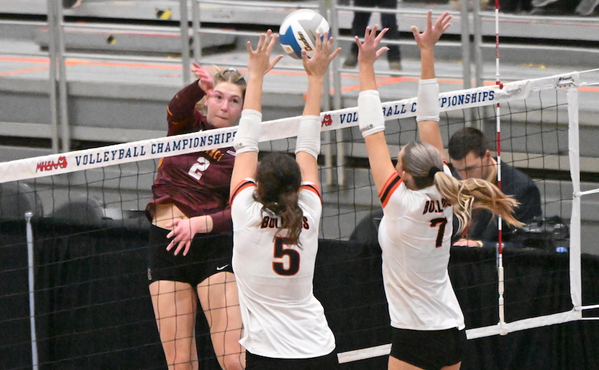 Farmington Hills Mercy junior Kate Kalcynski (2) attempts to slam a kill past Byron Center senior Lainey VanTol (5) and junior Cara Crittendon during the Marlins’ 25-27, 24-26, 25-16, 25-17, 16-14 victory. Kalcynski totaled 30 kills and 21 digs.