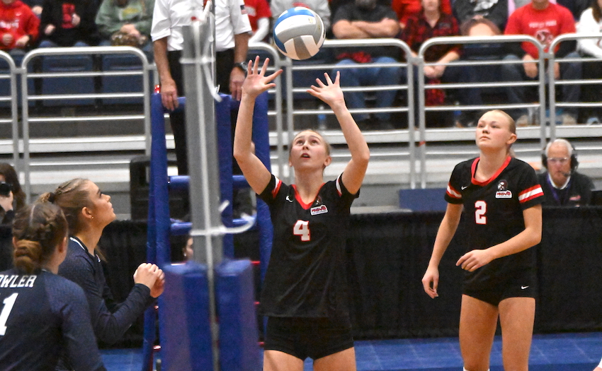 Forest Park junior Vienna Price (4) sets with senior Elsie Williams (2) ready for the next attack