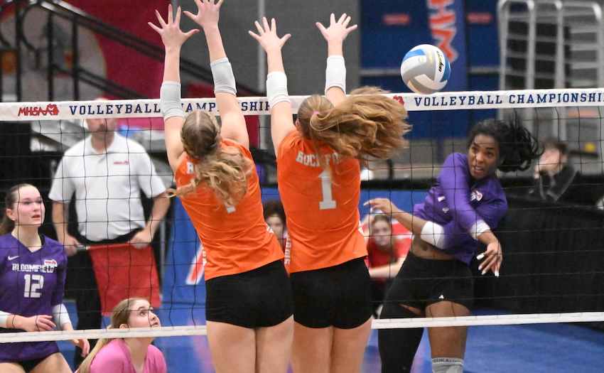 Bloomfield Hills senior Kayla Nwabueze sends a kill attempt into a Rockford block during the Black Hawks' 25-19, 22-25, 21-25, 25-22, 15-13 win over Rockford.