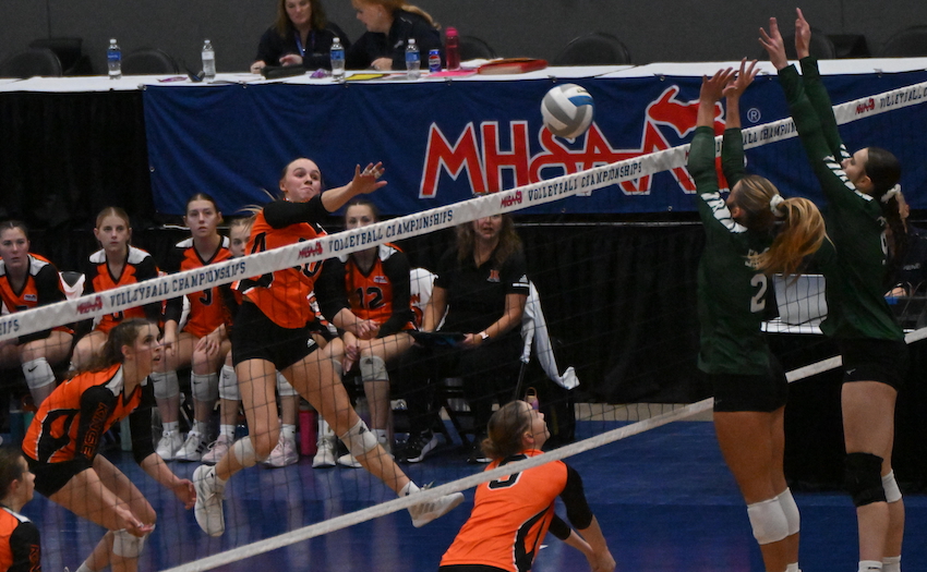 Kingsley junior Aizlyn McKinley (10) follows through on a kill attempt as Monroe St. Mary’s Olivia Beaudrie (2) and Kiley Urbanski (9) set up a block during the Stags’ 17-25, 25-19, 25-23, 8-25, 17-15 victory.