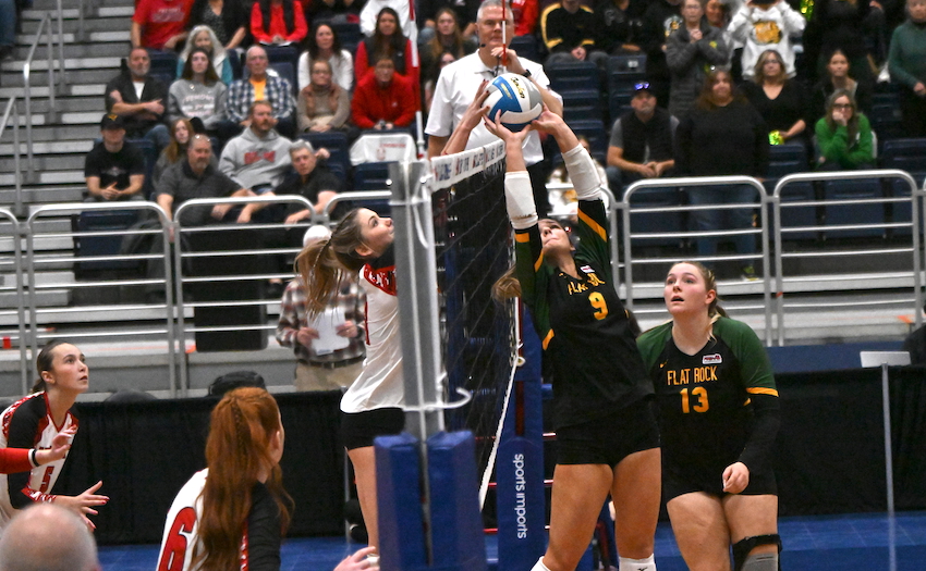 Flat Rock and Fremont players meet on a ball at the net during the Rams’ 25-20, 26-24, 23-25, 25-22 win.