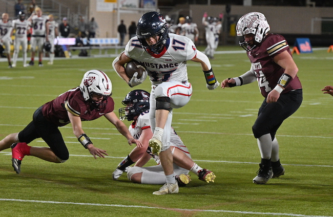 Montabella’s Brady Kieff steps into the end zone for the game’s first score.
