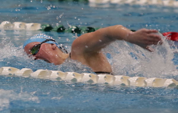 Ann Arbor Skyline’s Adrienne Schadler races to a repeat and meet record in the 500 freestyle.