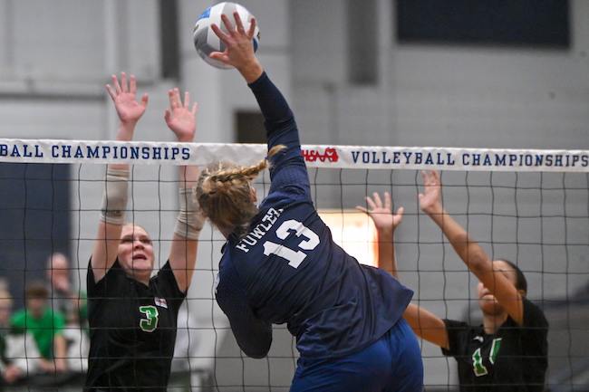 The Eagles’ Paige Thelen (13) connects as Karyssa Holtz (3) and Lashell Blair line up to block.