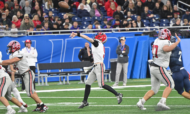 Divine Child quarterback Drew Sheridan tosses a pass. 