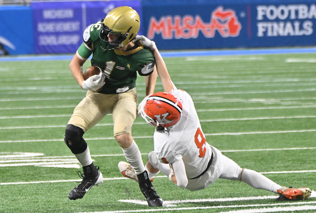 Kingsley’s Andrew George (8) works to bring down Wes Learned.