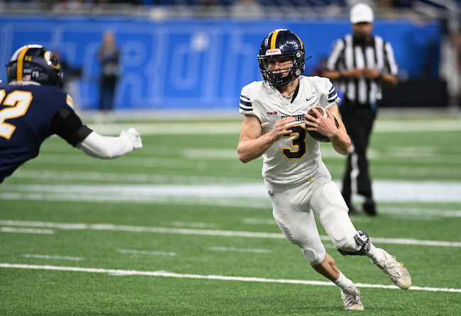 The Oilers’ Xavier Creguer prepares to take on a DeWitt defender.