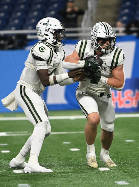 Augustyn hands off to Connor Olszewski (7).