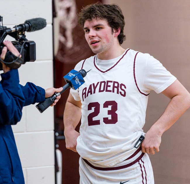 Gaffney is interviewed by a local TV station after his return to the court. 