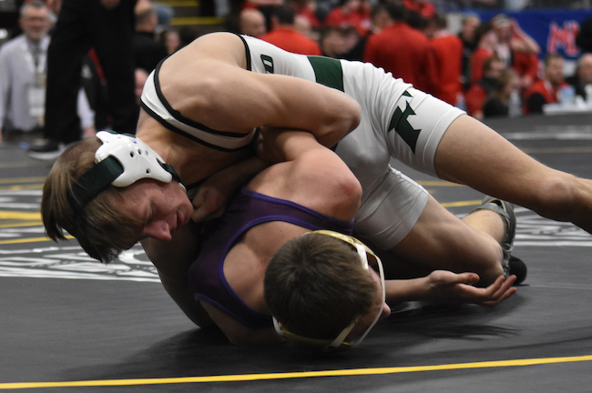 Easton Rosebush, top, works to roll over his Gladiators opponent. (