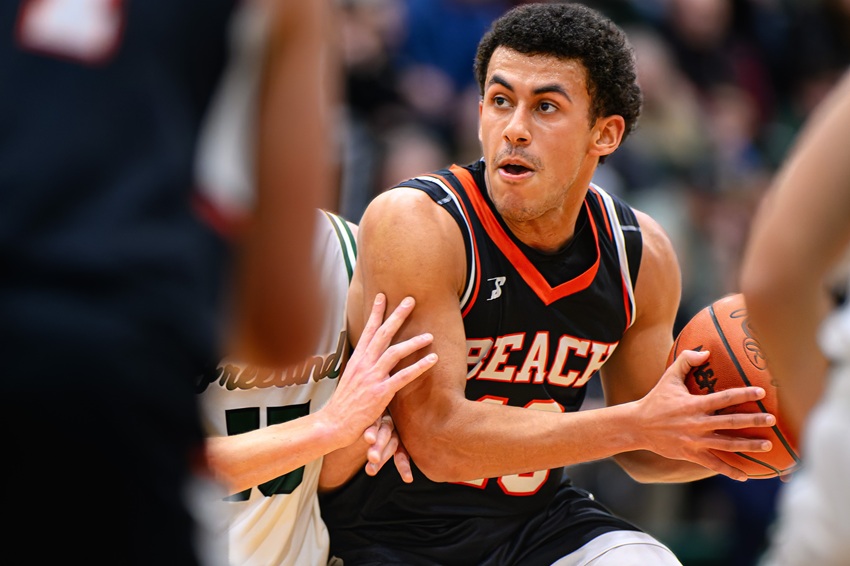 Harbor Beach guard Benson Harper works his way through the paint toward a second-quarter basket in his team’s Jan. 2 game against Freeland.