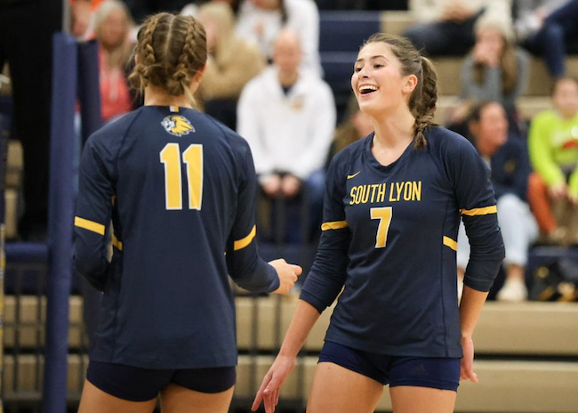 Wesner (7) shares a laugh with a volleyball teammate.