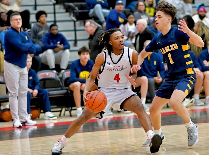 Hudsonville’ Jovaan Daniels (1) defends while Detroit University Prep’s Tony Dent drives during the Eagles’ 72-56 win also on Jan. 3.