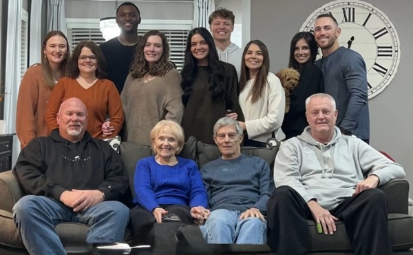 Linda and Jim Arnold, seated (middle) take a photo with their daughters and their families.