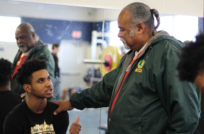 Duckett, right, speaks with a student during the 2018-19 school year. 