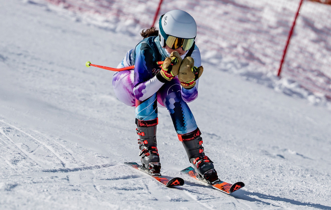 A skier races downhill during the Division 1 Finals. 