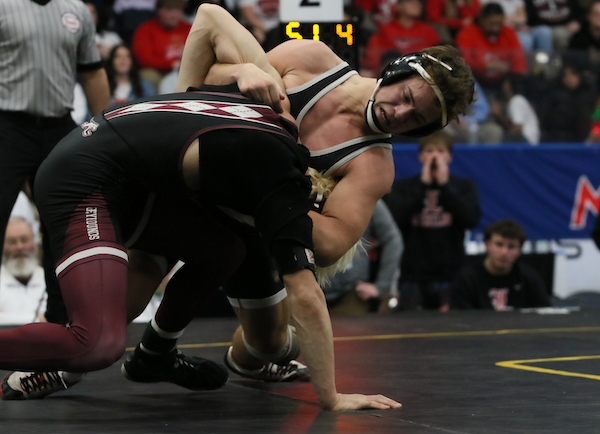Colton Barney, right, works towards a pin at 165.