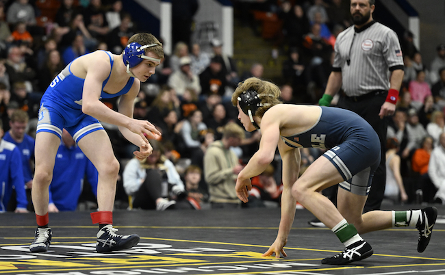 Ryan Williams, left, wrestles Yale’s William Lawson at 113 pounds.