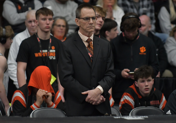 Marry monitors the action Saturday afternoon after becoming the state’s all-time winningest wrestling coach during the Semifinals earlier that day. 