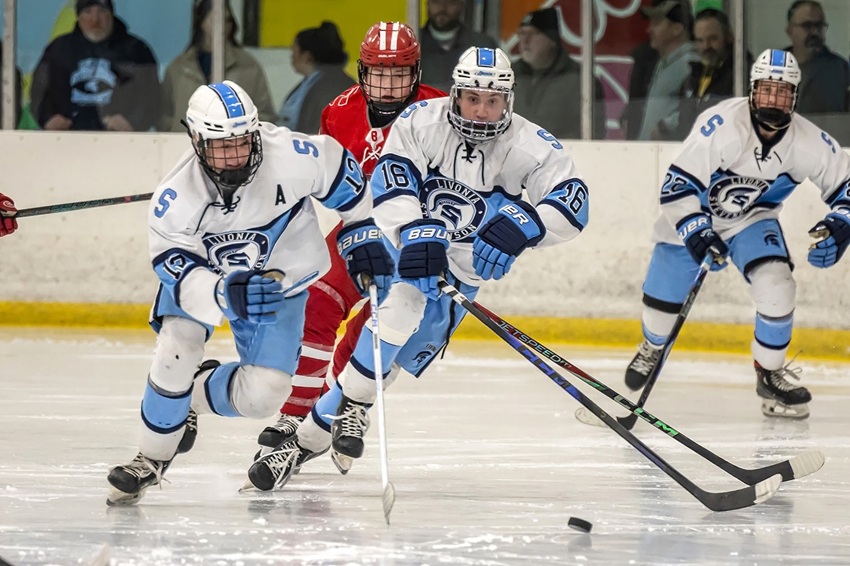 Garrett Teahan (12) and Brendan Sise (16) lead a rush during Stevenson’s win over Livonia Red on Jan. 3. 