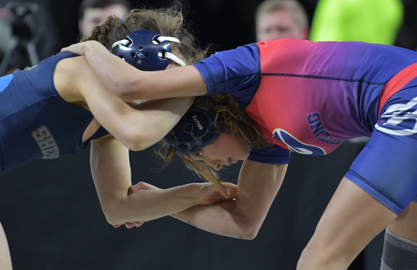 Westland John Glenn's Nakayla Dawson, right, locks up with Shepherd's Shai Curtiss during a 2025 Finals bout.