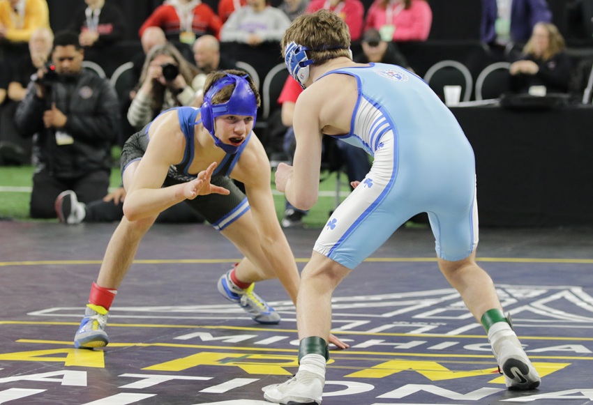 Detroit Catholic Central's Wyatt Lees, left, wrestles teammate Ryan Totten for the title at 120 pounds.