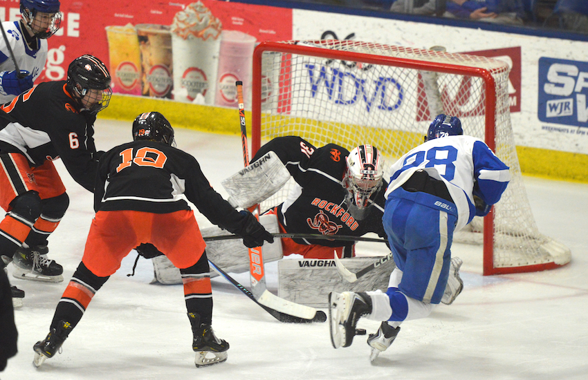 Rockford goalie Nolan Willams moves to protect his net as DCC’s Costa Karadimas approaches. Karadimas had a goal and an assist.