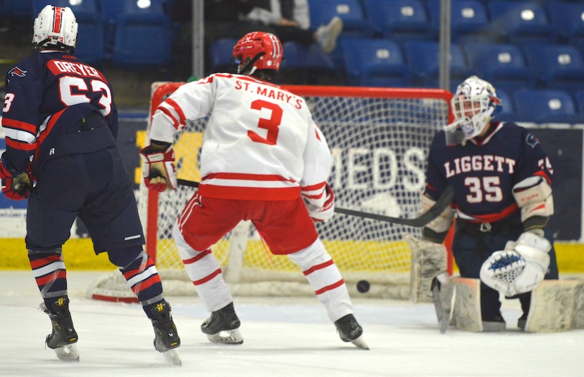 The puck rests in the back of the Knights’ net as Charlie Roberts (3) scores one of his two goals. He also had an assist.