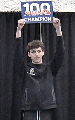 Rijnovean stands atop the podium after receiving his medal.